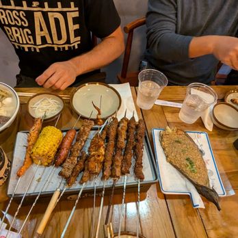 Dynasty BBQ - Bone broth soup, bunch of various skewers, garlic eggplant. - Chinese Near Me - Newark, California