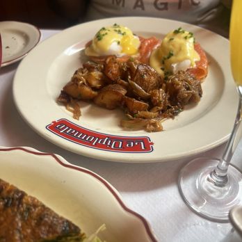 Le Diplomate - - Eggs Norwegian: smoked salmon, sauce hollandaise  - Pommes Lyonnaises:  pan-fried potatoes and caramelized onions - Brasseries Near Me - Washington, DC, District of Columbia