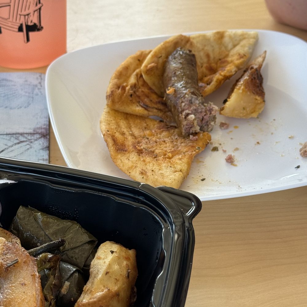 Gyro Kingdom - Greek sausage on a pita, not exactly the sandwich described on the menu - Greek Near Me - Brick Township, New Jersey Gyro Kingdom - Greek sausage on a pita, not exactly the sandwich described on the menu - Greek Near Me - Brick Township, New Jersey