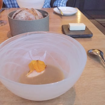Commis - House baked bread with warm lobster soup and yellow peach ice cream - New American Near Me - Oakland, California