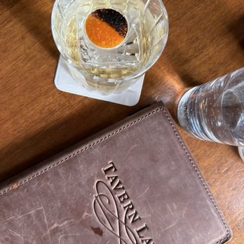 Tavern Law - Oaxacan Old Fashioned with an artful orange peel garnish - Cocktail Bars Near Me - Seattle, Washington