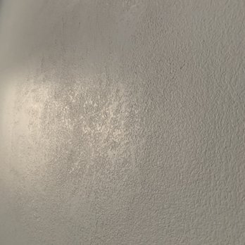HJN Home Services - a closeup of a white wall - Handyman Near Me