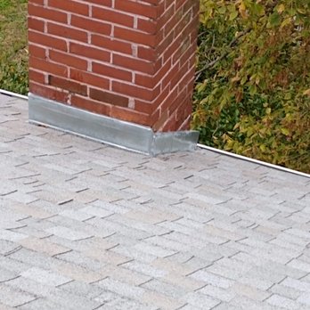 ATW Contracting - a brick chimney on a roof - Handyman Near Me - Alton, Illinois ATW Contracting - a brick chimney on a roof - Handyman Near Me - Alton, Illinois