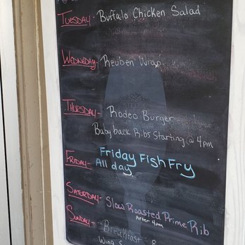 The Woods - a chalk board with a menu on it - New American Near Me - Lone Rock, Wisconsin