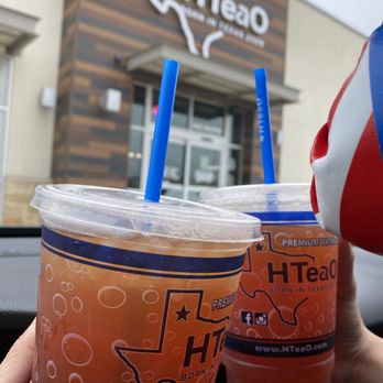HTeaO - a person holding two cups of iced tea - Coffee & Tea Near Me - San Antonio, Texas