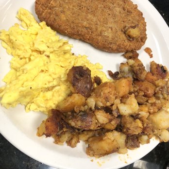 Bagelmania - Country Fried Steak with homemade potatoes and scrambled eggs (he requested gravy on the side?!). Don't ask me why. - Bagels Near Me - Sunrise, Florida