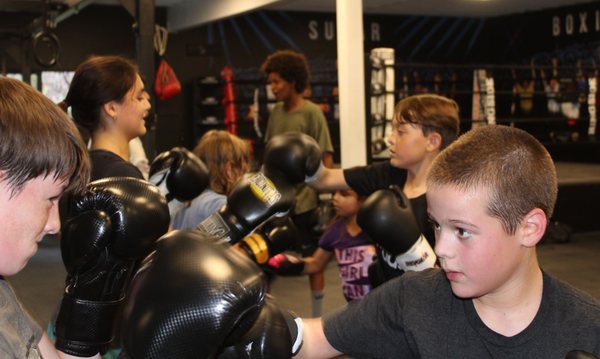 Youth Boxing - Our youth program builds confidence, community and strength. Our coaching staff is committed to enhancing your child's life long development. Youth Boxing - Our youth program builds confidence, community and strength. Our coaching staff is committed to enhancing your child's life long development.