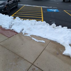 United States Post Office - The ramp from the parking lot was inaccessible due to snow. The USPS is a government entity; you above all should be ADA compliant!