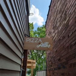 Pizza Alley - Look for the neon pizza alley sign between the buildings!