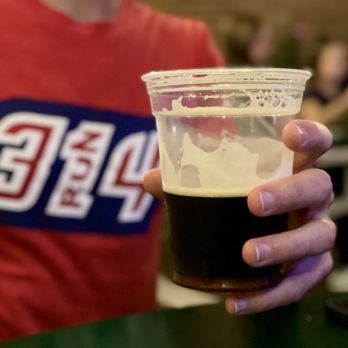 Great Grizzly Bear - a man holding a cup of beer - Bars Near Me - St. Louis, Missouri Great Grizzly Bear - a man holding a cup of beer - Bars Near Me - St. Louis, Missouri