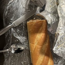 Leo's Steak Shop - The bread included packed separately and I had cut it in half to assemble the cheesesteak once home.
