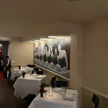 Il Postino - a dining room with tables and chairs - Italian Near Me - New York, New York