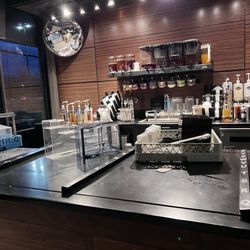 Starbucks - This is the pickup counter....very dirty. Dirty dishes piled in the same area for your pick up