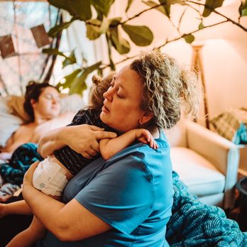 The Birthing Place - Janna holding an older sibling - Midwives Near Me - Charlottesville, Virginia The Birthing Place - Janna holding an older sibling - Midwives Near Me - Charlottesville, Virginia