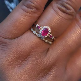 Rose gold with a Ruby center piece. Rose gold with a Ruby center piece.