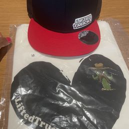 My complimentary Tee and Hat after purchasing a My complimentary Tee and Hat after purchasing a