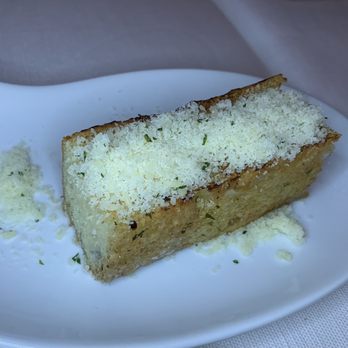 La Trattoria - Crouton topped with cheese - Italian Near Me - Cancún, ROO La Trattoria - Crouton topped with cheese - Italian Near Me - Cancún, ROO