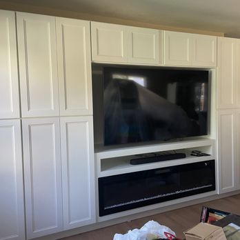 Perpetual Creations Remodeling - Installed media cabinet with custom built-in 72" electrical fireplace, media shelf with hide away boxes and inset TV section. - Flooring Near Me Perpetual Creations Remodeling - Installed media cabinet with custom built-in 72" electrical fireplace, media shelf with hide away boxes and inset TV section. - Flooring Near Me