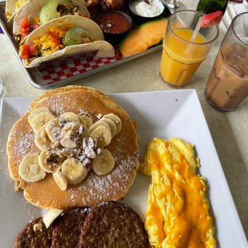 Eggs-Cetera Cafe - We had the breakfast tacos and eggs, Turkey sausage, banana nut pancakes (to die for)!! Mimosa, iced coffee and Oj. - American Near Me - Lake Worth, Florida