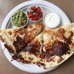 Delicious Chicken quesadilla with small side quac. Hit the spot.