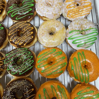 Top Donuts - a variety of donuts on a cooling rack - Donuts Near Me - Norwalk, California Top Donuts - a variety of donuts on a cooling rack - Donuts Near Me - Norwalk, California