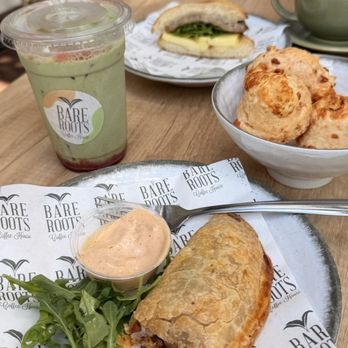 Bare Roots Coffee House - Beef empanada, Brazilian cheese balls, egg sausage sandwich, strawberry matcha latte, Cappuccino - Coffee & Tea Near Me - Fort Myers, Florida Bare Roots Coffee House - Beef empanada, Brazilian cheese balls, egg sausage sandwich, strawberry matcha latte, Cappuccino - Coffee & Tea Near Me - Fort Myers, Florida