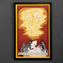 Add Art - Stacked a yellow frame within a matte black frame on this concert poster.