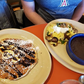 Snooze, an A.M. Eatery - Chocolate chip pancake.  Black beans in her scramble were refried? - Breakfast & Brunch Near Me - Phoenix, Arizona