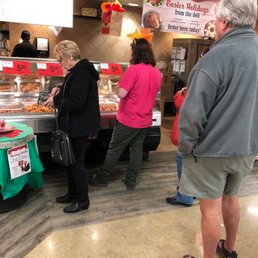 a group of people shopping at a food court a group of people shopping at a food court