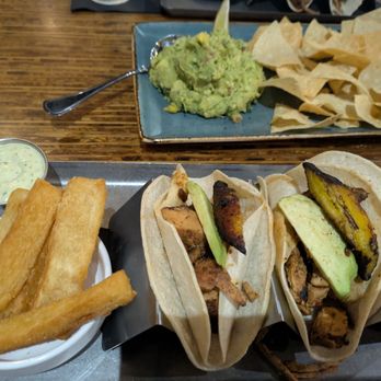 Zim Zari - Jerk Chicken Tacos (no cheese, crema on side), Yuca Fries - Burgers Near Me - Trinity, Florida Zim Zari - Jerk Chicken Tacos (no cheese, crema on side), Yuca Fries - Burgers Near Me - Trinity, Florida