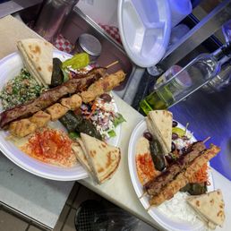 two plates of food on a counter two plates of food on a counter