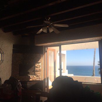 Las Rocas Resort - Hole in fireplace screen and thick dust on fan - Day Spas Near Me - Rosarito, BCN