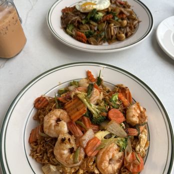 Thai Table - Thai Yaki Soba Lunch with shrimp, Drunken Noodle Lunch with beef and added a fried egg on top - Thai Near Me - Grand Rapids, Michigan