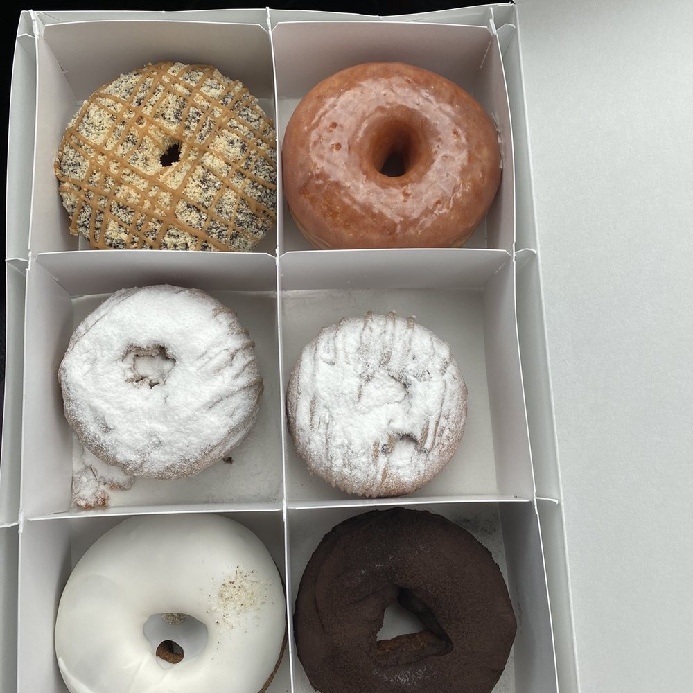 Beacon Doughnuts - Lcolumn starting at top: chocolate caramel shortbread, blueberry pancake, lavender vanilla, glazed, blueberry pancake, Boston cream pie - Donuts Near Me - Chicago, Illinois Beacon Doughnuts - Lcolumn starting at top: chocolate caramel shortbread, blueberry pancake, lavender vanilla, glazed, blueberry pancake, Boston cream pie - Donuts Near Me - Chicago, Illinois