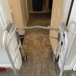 Doorway is too small for a walker to fit safely through to the bathroom.