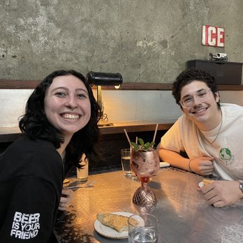 The Ice Plant - The kids enjoying the pineapple for two cocktails - Cocktail Bars Near Me - St. Augustine, Florida