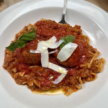 The Place - Tagliatelle Bolognese fresh tagliatelle pasta in a rich tomato-based meat sauce, made with beef, pork, and veal (chef suggests + meatballs) - Italian Near Me - Roseville, California The Place - Tagliatelle Bolognese fresh tagliatelle pasta in a rich tomato-based meat sauce, made with beef, pork, and veal (chef suggests + meatballs) - Italian Near Me - Roseville, California