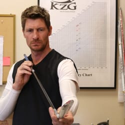 KZG Performance Center - KZG Performance Center - One of our World Class Fitters eyeing up some measurements