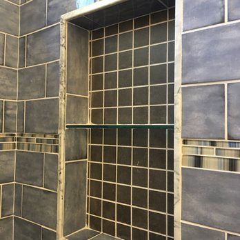 Conte Improvements & Remodeling - a glass shelf in the shower - General Contractors Near Me Conte Improvements & Remodeling - a glass shelf in the shower - General Contractors Near Me