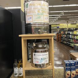 Winn-Dixie - Large vats of Ariston cold-pressed EVOO and smaller vat of Ariston Balsamic vinegar for refill. Joanna-can you imagine?