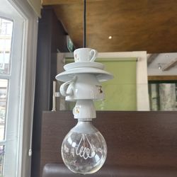 Boulevard-Cafe - Cute fixtures over the tables!