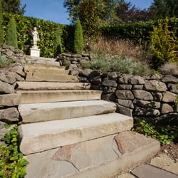 Photo of Closer to Nature Landscape - Seattle, WA, US. Pennsylvania Bluestone saw-cut treads.