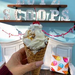 Double scoop in a waffle cone Cookies n cream and snickers with whipped cream and a cherry on top Double scoop in a waffle cone Cookies n cream and snickers with whipped cream and a cherry on top
