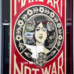 Work of Art Gallery and Framing - Limited edition print by Obey, black mat with a red wedge, shadow box frame & museum glass.
