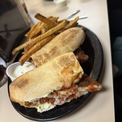 Cock & Bull Villa Roma - Chicken Parm sandwich with fries