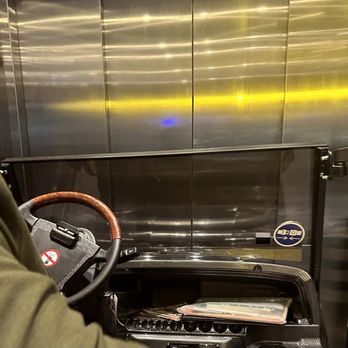 SilverKris Lounge - Cart in an elevator to the A gates - Airport Lounges Near Me - Greater London, XGL