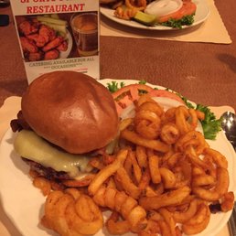 Piedmontese Beef Brisket Burger Special - topped w/ aged white cheddar & thick sliced bacon, on a brioche bun & a side of Curly fries. Piedmontese Beef Brisket Burger Special - topped w/ aged white cheddar & thick sliced bacon, on a brioche bun & a side of Curly fries.