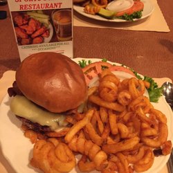 Sports Scene Restaurant - Piedmontese Beef Brisket Burger Special - topped w/ aged white cheddar & thick sliced bacon, on a brioche bun & a side of Curly fries.