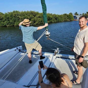 Island Time Marina - My daughter- in-laws brother hanging on to the sail with my son and Daughter in law. - Marinas Near Me - Cocoa Beach, Florida Island Time Marina - My daughter- in-laws brother hanging on to the sail with my son and Daughter in law. - Marinas Near Me - Cocoa Beach, Florida