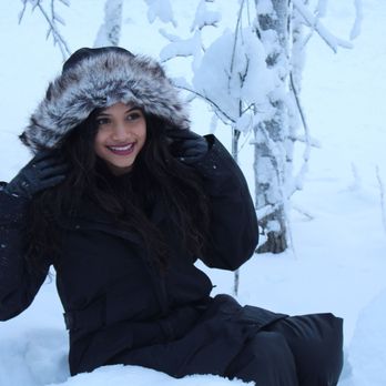 Alaska Element - Sitting in the snow with the boots, bib & jacket from Alaska Element! - Clothing Rental Near Me